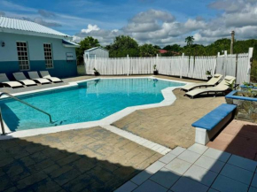 Tropical Oasis with pool that sleeps 12